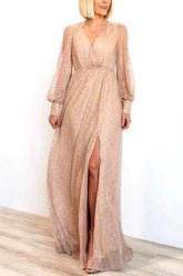 Vestido largo con abertura y mangas largas abullonadas y brillantes